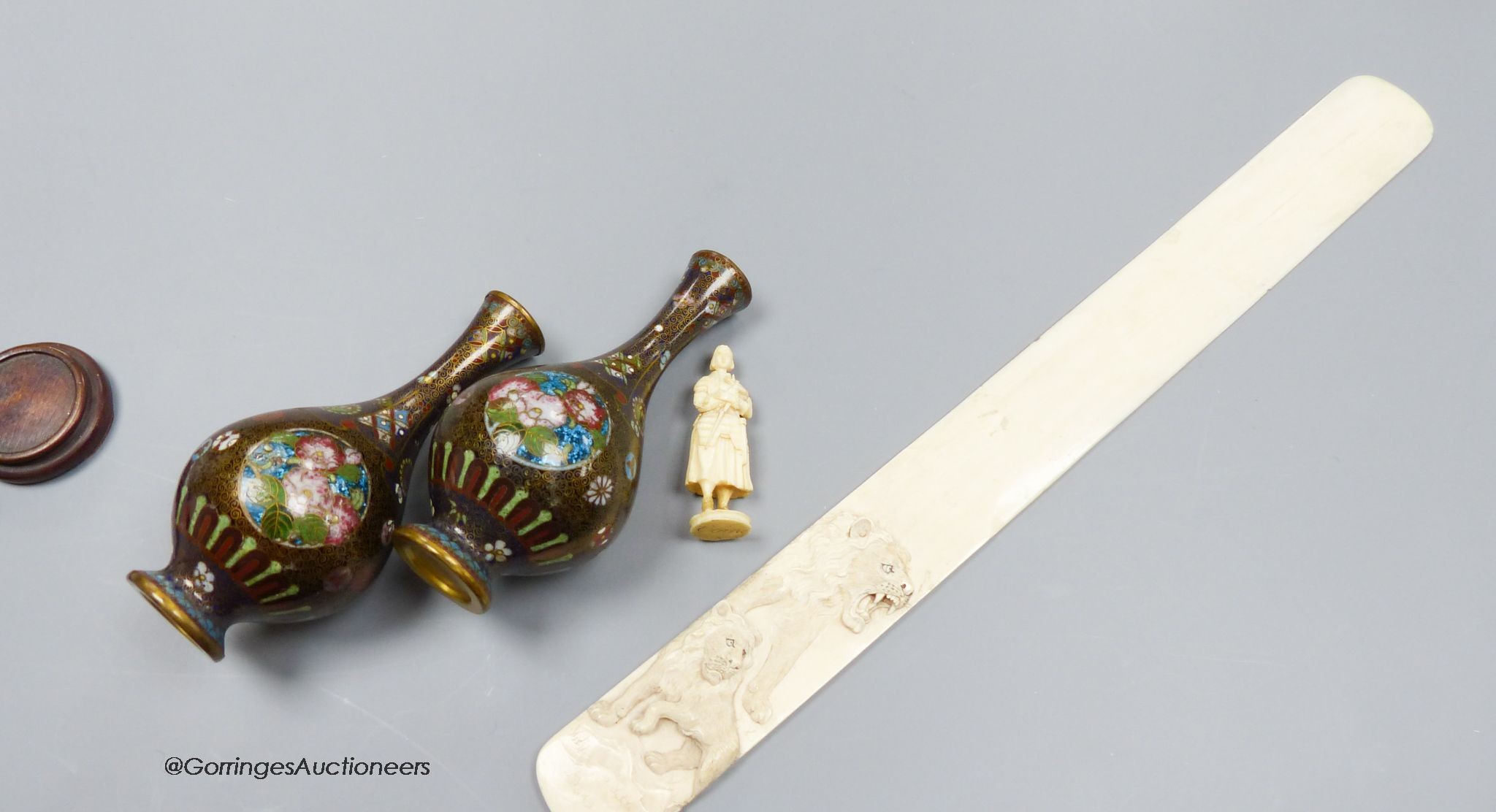 A pair of Japanese cloisonne miniature vases, a carved ivory paper knife, length 37cm, and a carved ivory figure